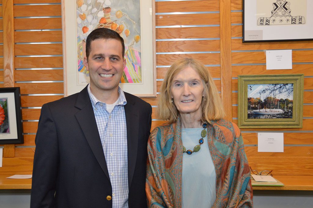 A BIG TURNOUT filled the Flint Memorial Library Reading Room on Saturday for a reception honoring retired Library Director Helena Minton, who stepped down after 13 years. Above, Mrs. Minton is shown with Town Administrator Michael Gilleberto. (Bob Turosz Photo)