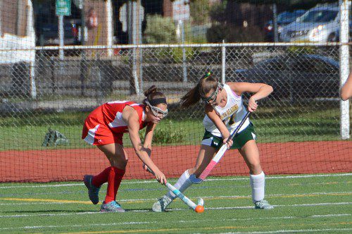TIE TO TOE. Hornet junior Michelle Maidment fights her Masco opponent for the ball at the Arthur Kenney Turf Field. (John Friberg Photo) 