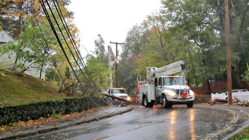 FOUR UTILITY POLES owned by the Wakefield Municipal Gas and Light Department reportedly went down during the night on Forest Street due to the storm's gusty winds. Sixty homes in the area were left without power. (Gail Lowe Photo)
