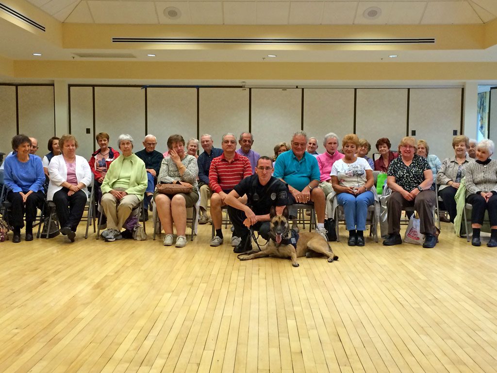 K9 ACE and his handler, Lynnfield police officer Ray Barnes, recently visited the Senior Center to introduce the new policing team to local senior citizens. An inquisitive 2-year-old Belgium Malinois, he was bred specifically to excel at police work. Ace joined the force in August after graduating from K9 training school with Barnes. Ace's certified patrol skills include tracking, evidence recovery, apprehension, handler protection, agility and building searches. He will eventually be certified to locate narcotics.        (Courtesy Photo)