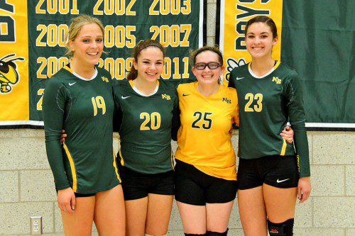 FOUR SENIORS on the volleyball team were honored before the Hornets beat Triton last week to make the state tournament. From left: Montana Robertson, Olivia Krol, Amanda Catania and Allison D'Orlando. (John Friberg Photo)