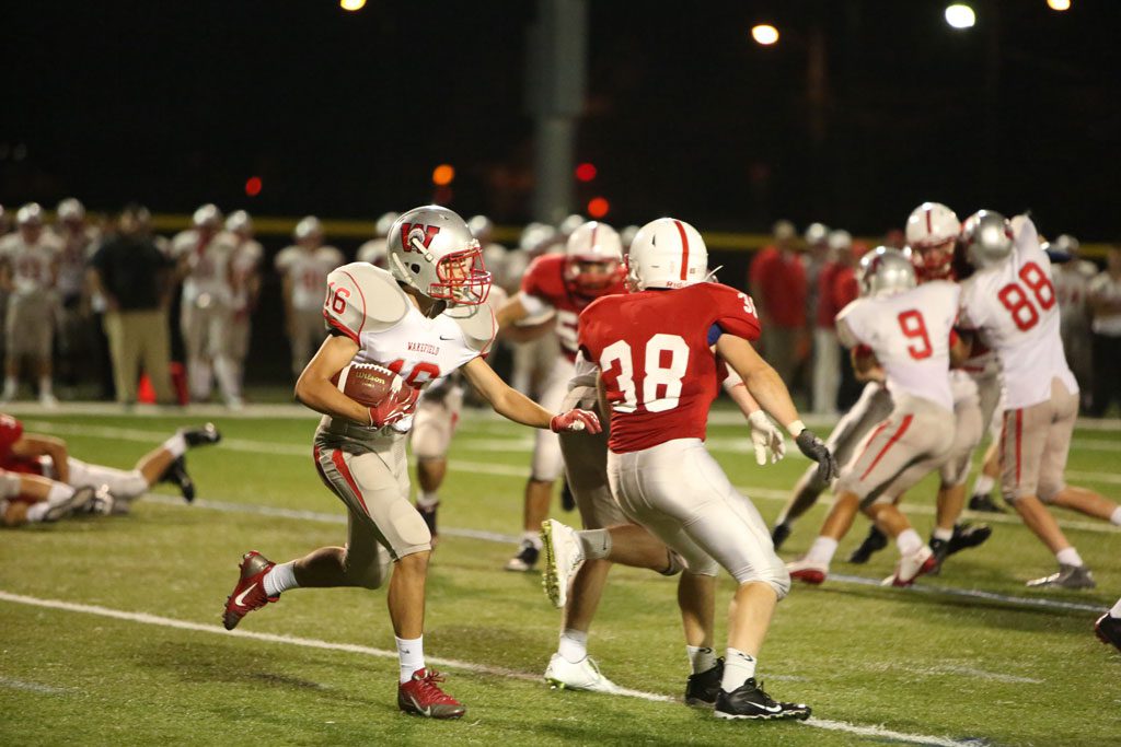CARMEN SORRENTINO, a sophomore #16, returns a kickoff against Melrose from Wakefield's game against the Red Raiders two weeks ago. The Warriors are hoping a return to Landrigan Field will help them end a two-game losing streak. (Donna Larsson File Photo)