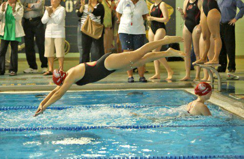 AVERY YORK, a senior co-captain, dives into the water during a recent meet. York swam two relays for the Warriors which took second place in Wakefield’s dual meet finale against Winchester. (Donna Larsson File Photo)