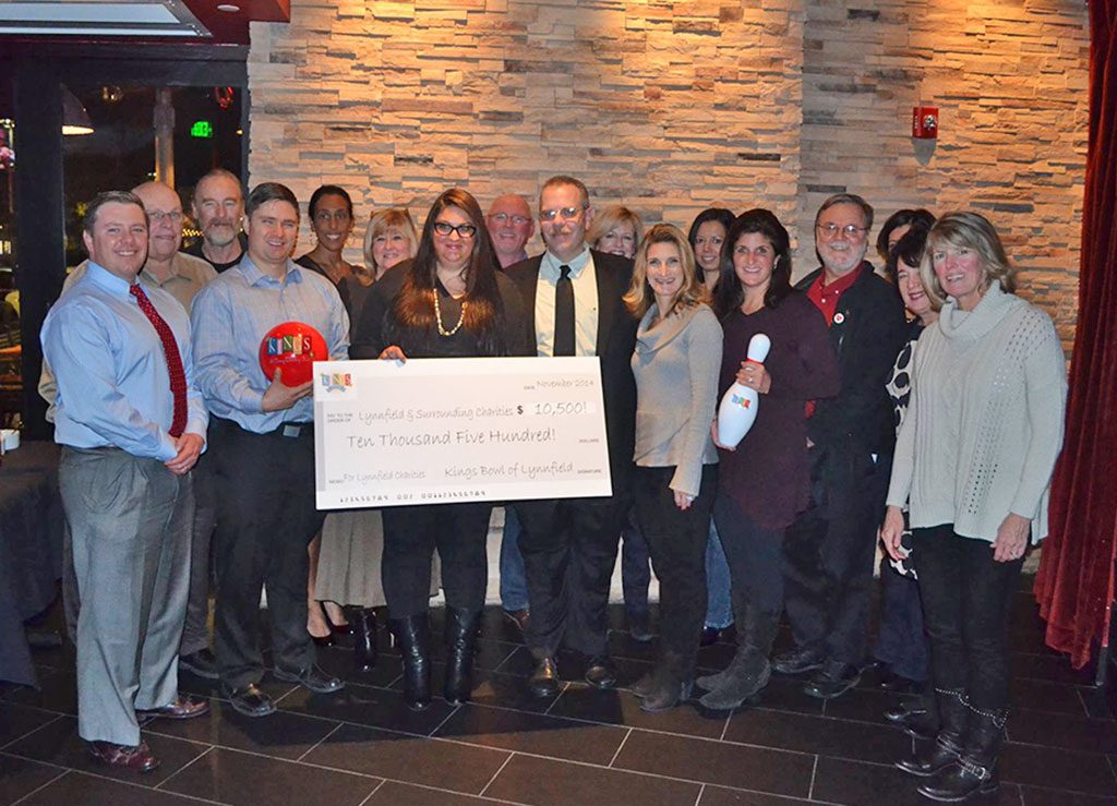 KINGS held its second annual Kings Cares: A Night of Food, Fun and Giving Back on Thursday, Nov. 6. General manager Steve Blacquiere (center) presented a check to seven Lynnfield charities during the fundraiser. The charity organizations supported by Kings are Lynnfield Rotary, Lynnfield Athletic Association (LAA), Lynnfield Educational Trust (LET), the Angel Fund, Gathering Change, Inc., Lynnfield Historical Society and Friends of the Lynnfield Library. Kings will be donating $1,500 to each charity organization.   (Kings Lynnfield Photo)