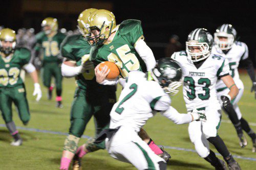 GROUND GAME. Hornet sophomore Matt McCarthy gained 14 yards on this play as North Reading avenged its earlier season loss to Pentucket. (Bob Turosz Photo)