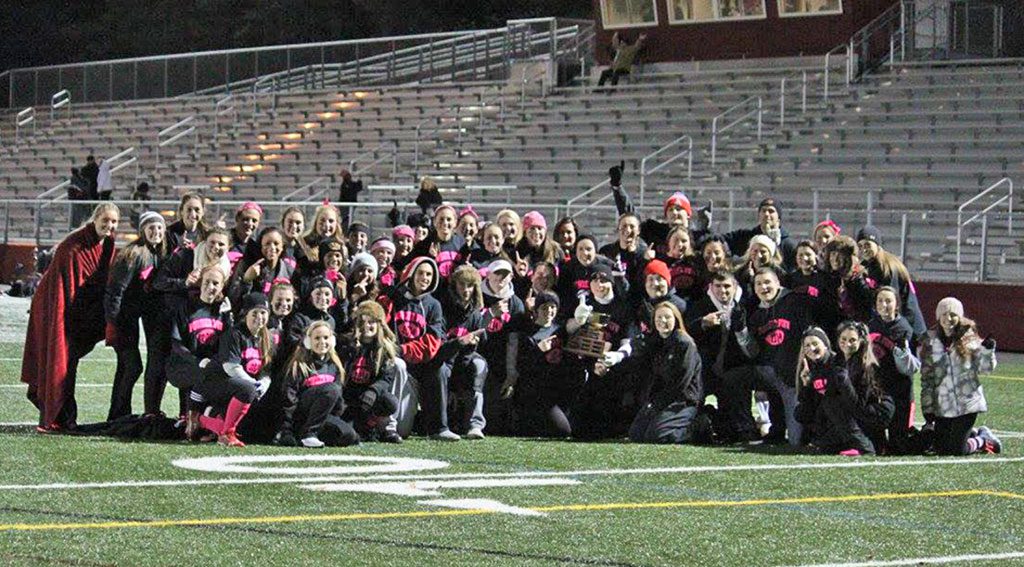 THE CLASS of 2015 (seniors) was victorious over the Class of 2016 (juniors) in the annual Powder Puff football game which was played on Nov. 19. Pictured are the seniors surrounding the coveted Powder Puff championship trophy. This event was held at Landrigan Field and sponsored by the WMHS Student Council. 