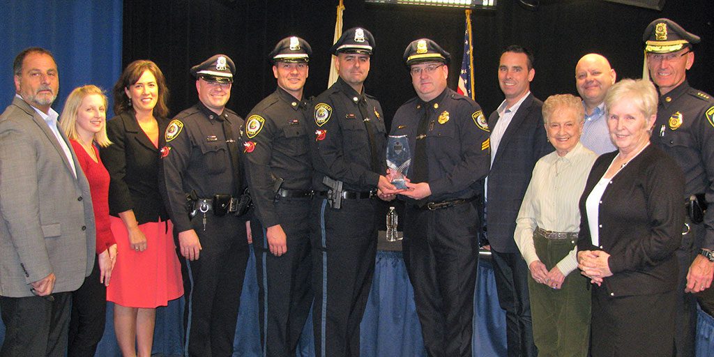THE BOARD OF SELECTMEN congratulated the Wakefield Police Department for being one of only 10 departments worldwide to receive the Community Policing Award from International Association of Chiefs of Police. From left, Selectman Paul DiNocco, Clinician Jennifer Waczkowski, Selectman Ann Santos, Officer Joseph Lyons, Officer Jason Skillings, Detective Kenneth Silva, Sgt. Kevin McCaul, Chairman Brian Falvey, Selectman Phyllis Hull, Selectman Tiziano Doto, Selectman Betsy Sheeran and Police Chief Rick Smith. (Mark Sardella Photo)