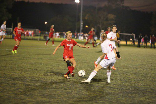 GRACE HURLEY (#8), a junior midfielder/striker, scored Wakefield’s first goal of the game last night in the Warriors girls’ soccer team’s Div. 2 North first round contest against Arlington last night at Pierce Field. Wakefield was edged by the Spy Ponders, 3-2, to have its season come to an end. (Donna Larsson File Photo)