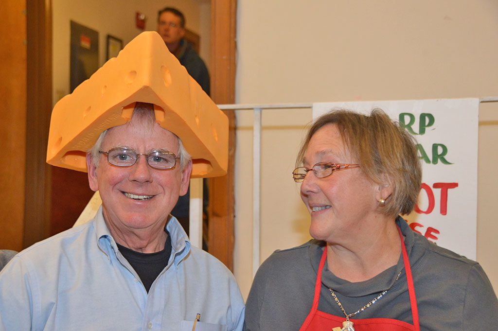 CHEESEHEADS John and Ellen Wiklanski did a landslide business selling fresh Vermont cheese at this year's Frosty's Fair at the Union Congregational Church. (Bob Turosz Photo)