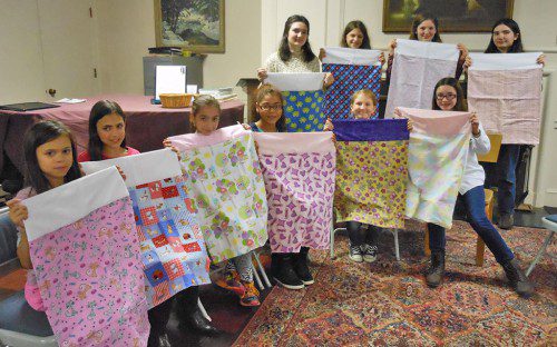 MEMBERS OF THE Nifty Needle 4-H Club of Wakefield spent an afternoon sewing pillowcases for hospitalized children with cancer. From left to right front row: Evalyn Rizzuto, Annella Rizzuto, Grace Russo, Destiny Hiltpold, Eva d’Entremont, Olivia Donnelly. Second row – Eleanora Peters, Ava Aureli, Rose Peters and Regina Peters.