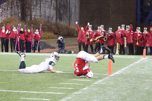 IT'S WAIT until next year for the Melrose Red Raider football team who fell short to Dartmouth High School, 14-7 at the Div. 3 Superbowl on December 6 at Gillette Stadium. Pictured is Red Raider sophomore Mike Pedrini with an impressive catch for Melrose which set up their only touchdown. (Donna Larsson photo) 