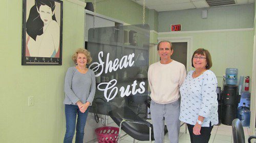 SHEAR CUTS owners Michael DiNauto and Yvonne George, in business for the past 29 years in Wakefield, 18 spent on Albion Street, will retire on Christmas Eve. From left: George, DiNauto and hair stylist Nancy Muise. (Gail Lowe Photo)