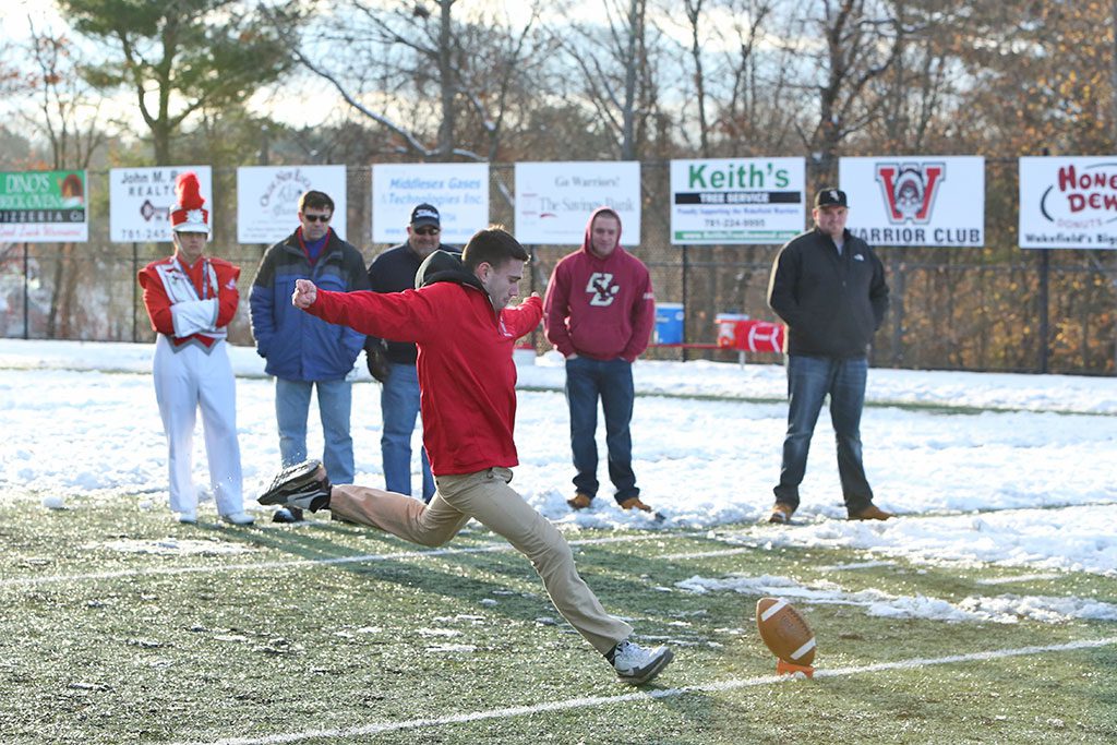 WAKEFIELD MEMORIAL High School senior Kyle Geaney was chosen to attempt a 35 yard field goal sponsored by Tarpey Insurance each year during halftime of the Thanksgiving Classic between Wakefield and Melrose. Geaney, a soccer player, had a nice attempt but it came up short. (Donna Larsson Photo)