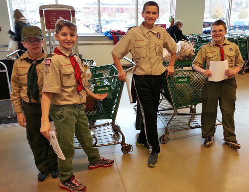 THE Wakefield Interfaith Food Pantry recently acknowledged and thanked Boy Scout Troop 701 for their successful food drive held on Nov. 22. From left: Boy Scouts Thomas Witham, Nicholas Major, Eli Gosselin-Smoske and Mattew Cheffro.