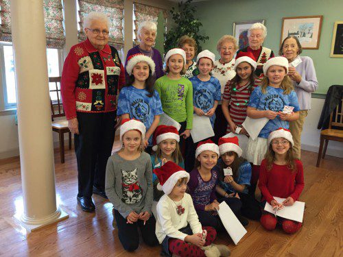 WALTON SCHOOL BROWNIE Troop #65416  sang Christmas carols Wednesday to the folks at the Stoneham Senior Center on Elm Street. (Michele Dowd Photo)