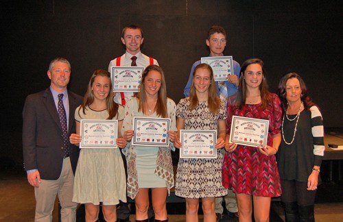 THE WMHS girls’ and boys’ cross country teams had six Middlesex League Freedom division all-stars named. The girls had four runners honored and the boys had two. In the front row are Boys’ Head Coach Perry Pappas, Lauren Sallade, Emily Hammond, Abby Harrington, Sara Custodio and Girls’ Head Coach Karen Barrett. In the back are Jackson Gallagher (left) and Richard Custodio.