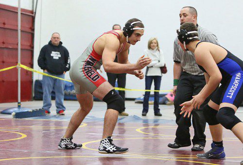 ROB NOHELTY, a first-year senior (left), earned his first varsity win by fall at 36 seconds against Marblehead/Swampscott’s Iassac Janock (right) at the 182 weight class during the Anthony Lisitano Memorial Tournament on Saturday at the Charbonneau Field House. (Donna Larsson Photo)