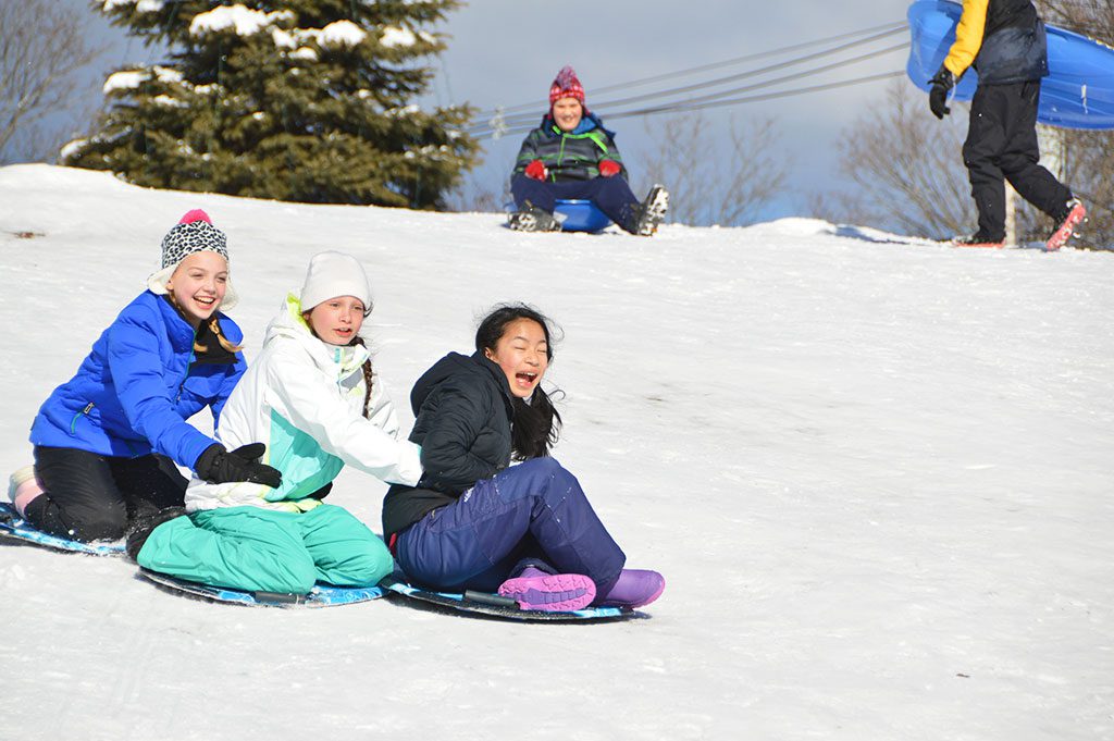 THE FIRST SIGNIFICANT storm of the season dropped about six inches of snow on the town last weekend, the harbinger of a much heavier blizzard that arrived on Tuesday and dumped 30 inches. From left: Analise Gonzalez, Sophia Galuppo and Mia Wieczorek take the down hill challenge on the common. (Bob Turosz Photo)