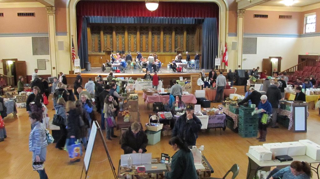 THIS winter, the ever-popular Farmers Market in Wakefield was taken indoors at Memorial Hall in Melrose. The market continues to thrive, even in cold, rainy weather, as was experienced on Sunday, Jan. 19. Three more markets will be held from noon to 4 p.m. on Sundays, Feb. 15, March 15 and April 19. The market will resume in Wakefield sometime in June. (Gail Lowe Photo)