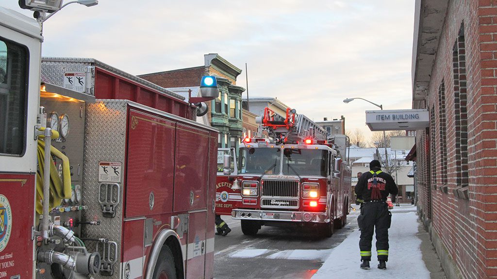 JUST AS  THE Daily Item was opening for business this morning, firefighters were called due to a problem with the oil burner. The company closed early but will be open for business during our regular hours on Monday. (Gail Lowe Photo)