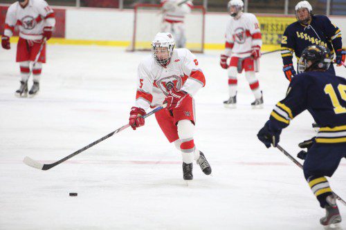 JAMES MCAULIFFE, a senior forward, skates up the ice with the puck. The Warriors took on rival Melrose on Saturday night at the Kasabuski Arena. Wakefield played the Red Raiders tough until the final period when Melrose pulled away for a 4-1 victory over the Warriors. (Donna Larsson File Photo)