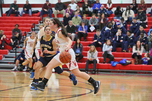 JUNIOR FORWARD Gabrielle Joly dribbles the ball up the court during a recent game. Joly had a solid all-around game in Wakefield’s 39-18 victory over Concord-Carlisle. Joly hit a three-pointer and had three steals in the contest. (Donna Larsson File Photo)