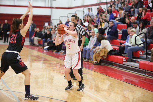 AMANDA BOULTER, a senior guard, scored a game high 17 points including four three-pointers as the Warriors posted a 51-41 triumph over Winchester on Friday night at the Charbonneau Field House. (Donna Larsson Photo)