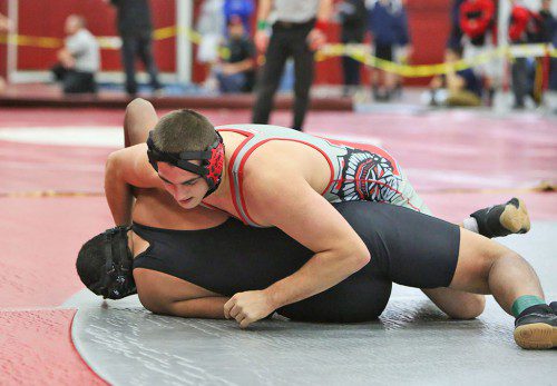 DAN WENSLEY (top) captured fourth place in the 195 weight class at the Lowell Holiday Tournament. Wensley also posted three victories in a quad-meet on Wednesday at Woburn High School. (Donna Larsson File Photo)