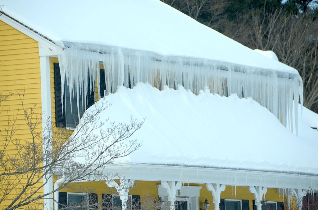 A PERFECT ROW of icicles cover the windows of this home on Eisenhaure Lane. (John Friberg Photo)