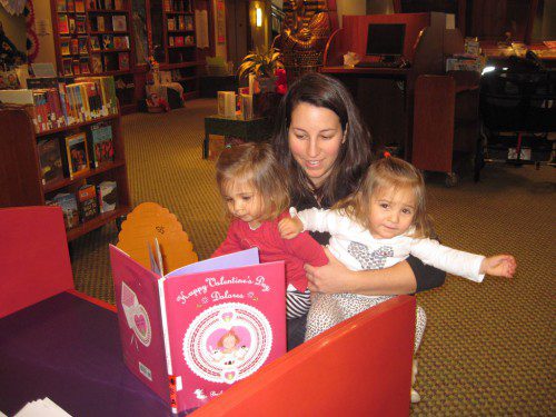 THE Beebe Library is a great place to fall in love because of its wide array of romance novels and Valentine’s Day books for children. Montrose resident Jena Lepore found the perfect book to read to her twins Allesandra, left, and Eliana Lepore. (Gail Lowe Photo)