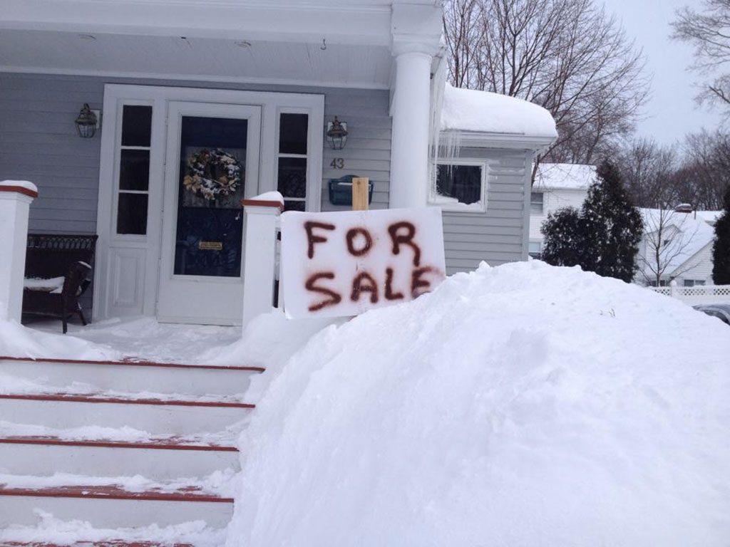 FED UP WITH what has amounted to an unprecedented snow blitz over the course of 21 days, homeowners on Meridian Street put up this sign, hopefully in jest. (Jennifer Gentile Photo)