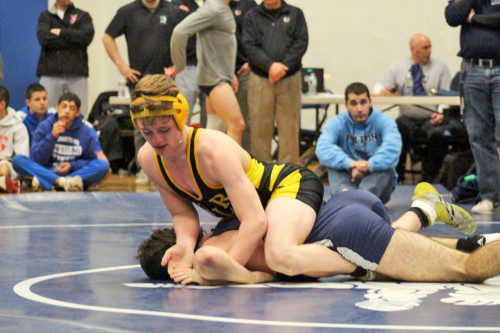 SENIOR CAPTAIN Dominic Monzione (on top) became a two-time Cape Ann League/Northeastern Conference Tournament place finisher after defeating Triton’s Jake Durkin by a 7-6 decision in the final round of the 145 lbs. weight class on Jan. 31. (Courtesy Photo)