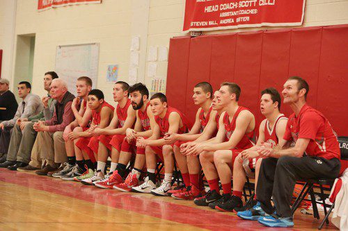 THE WARRIOR bench can only look on as Melrose prevailed in the regular season finale last night at the Melrose Veterans Memorial Middle School Gymnasium. As a result, Wakefield, Melrose and Watertown finished in a three-way tie for the Middlesex League Freedom division title. (Donna Larsson Photo)