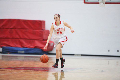 MACKENZIE COLLINS, a senior guard, dribbles the ball up the court during last night’s Div. 2 North first round game at the Charbonneau Field House. Collins scored five points off the bench including a three-point shot as the Warriors rolled to a 55-38 triumph over Triton. (Donna Larsson Photo)