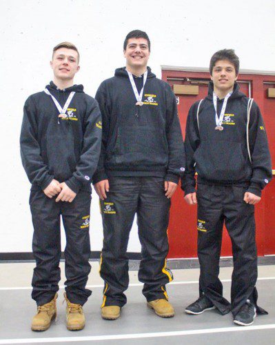 LYNNFIELD-NORTH READING co-operative wrestlers, from left, Dominic Monzione, Brandon Troisi and Max Whyman placed during the Division 3 State Tournament at Wakefield Memorial High School last weekend. Monzione finished fifth in the 145 lbs. weight class, Troisi was third in the 285 lbs. weight class and Whyman was sixth in the 126 lbs. weight class. (Courtesy Photo)