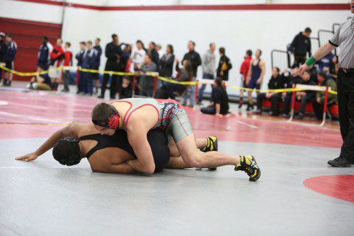DAN WENSLEY, a senior (right), captured the 195 weight class title at the Middlesex League Tournament which was held on Saturday at Melrose High School. Wensley posted a 3-0 record. (Donna Larsson File Photo)