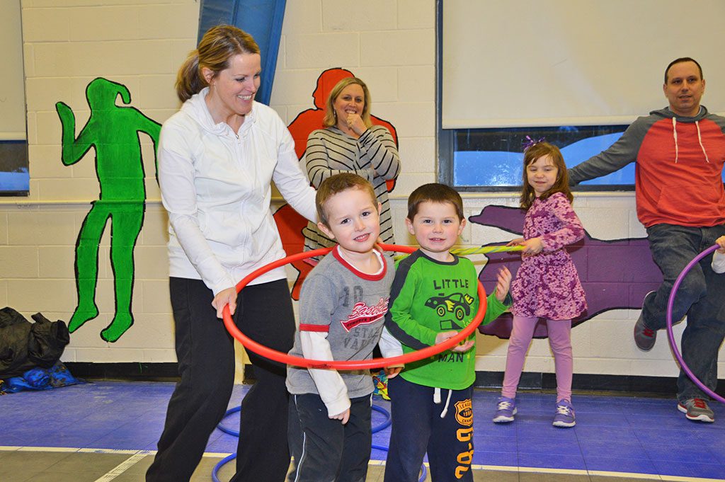 TWO HUNDRED PEOPLE attended the seventh annual Family Fitness Night at the Little School. But no one had more fun than Ann Tiberii, (above), with Cole Verdonck and Kellen Tiberii. (Bob Turosz Photo)