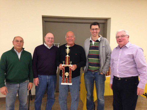 THE BEACH CITY BOYS are, from the left, Mark Mattera, John Giamattei, captain Steve Pavey and John Mitchell. They were presented their first place trophy by Trivia Team Challenge Co-Chairman Noel Bailey, far right. 