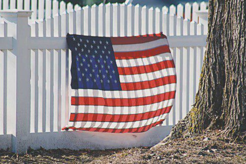 PATRIOTS’ DAY is celebrated today in commemoration of the battles at Lexington and Concord between the colonists and British soldiers on April 19, 1775, sparking the American Revolution. An American flag billowing in the breeze at the corner of Vernon Street and Wave Avenue commemorates the sacrifices made by these patriots for freedom 240 years ago. (Maureen Doherty Photo)