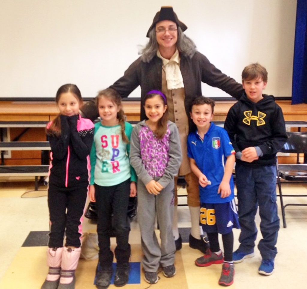 HUCKLEBERRY HILL students, from left, Nicole Sorrentino, Taylor Collins, Ariana Guarracino, Max LoGrasso and Kye McClory learned a great deal about Benjamin Franklin (portrayed by Kyle Blanchette from Young Audiences of Massachusetts) during a recent PTO-sponsored event. (Courtesy Photo)