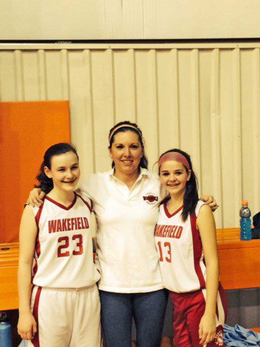 TWO WAKEFIELD basketball players, Caitlin Bracken (#23) and Micayla Rossi (#13) were named to the Merrimack Valley League Seventh grade Girls All-Star team. Pictured with Bracken and Rossi is Coach Gina Scheer.