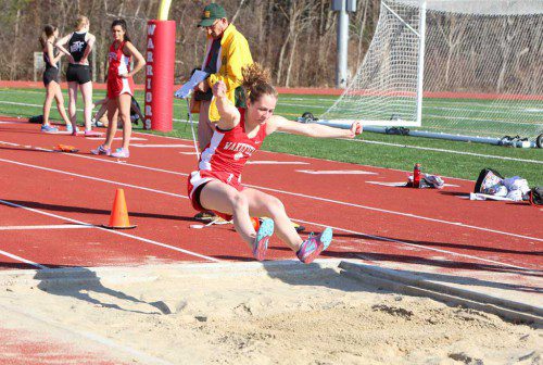 ABBY HARRINGTON, a sophomore, captured second place in the long jump with a distance of 14-4 1/2 and she captured first place in the 400 hurdles with a time of 71.9 seconds in Wakefield’s meet against Stoneham yesterday afternoon at the Beasley Track and Field facility. (Donna Larsson File Photo)