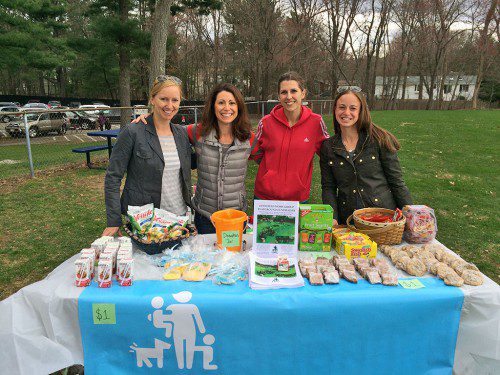 THE LYNNFIELD Moms Group is holding weekly bake sales on Sundays this spring during Lynnfield Youth Soccer games to raise funds for upgraded children's playgrounds at Glen Meadow Park and Jordan Park. Offering the yummy treats along with fliers detailing their proposed re-design of Glen Meadow Park are (from left): Erika Wilson, Sonia Brady, Erica Kelly and Melissa Adams. Final timelines and costs with each project have not yet been finalized. (Courtesy Photo)