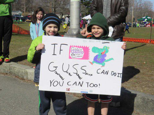 GREENWOOD School first grade students Francesco Fulciniti, left, and Gabe Guida were on the sidelines Saturday, April 11, cheering on the Gator Gallop 5K runners. (Courtesy Photo)