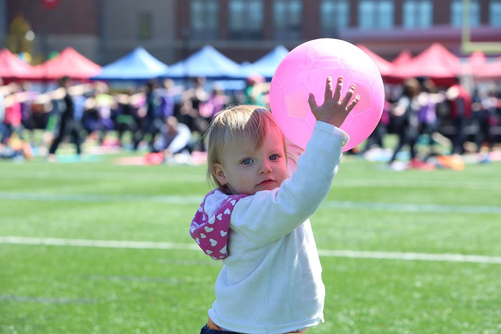 DURING THE MAY 2 Healthy Melrose Family Wellness and Fitness Fair at Fred Green Field, two-year-old Annabelle hauls in this toss from her father. (Donna Larsson Photo)
