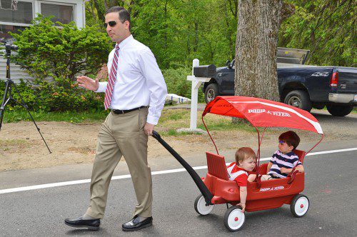 "WE'LL SEE MOMMY SOON." Town Administrator Michael Gilleberto marched the Memorial Day Parade route with his two sons, Noah and Max, in tow. (Bob Turosz Photo)