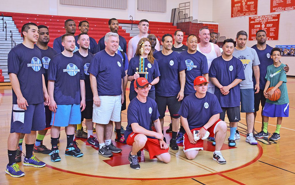 OVER 130 local first responders took part in the the 3rd annual Boston Strong First Responder Basketball Tournament held May 16-17 at Melrose High School, an event that honored late M.I.T. Officer Sean Collier. Both Melrose Police and Melrose Fire Department formed a team to compete in the 2-day event. The tournament was won by Massachusetts State Police East, pictured with Melrose Mayor Robert Dolan and Melrose Alderman Jennifer Lemmerman, sister of the late Officer Collier. For more on the two day tournament see our Sport section. (Steve Karampalas photo)