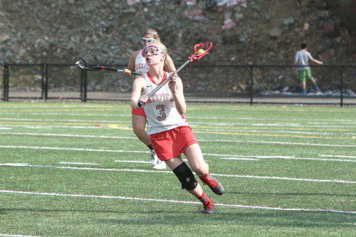 KELSEY CZARNOTA, a sophomore, netted six goals and assisted on four in Wakefield’s 18-5 rout over Bedford yesterday afternoon at Landrigan Field. The Warriors clinched a state tournament berth with the victory. (Donna Larsson File Photo)