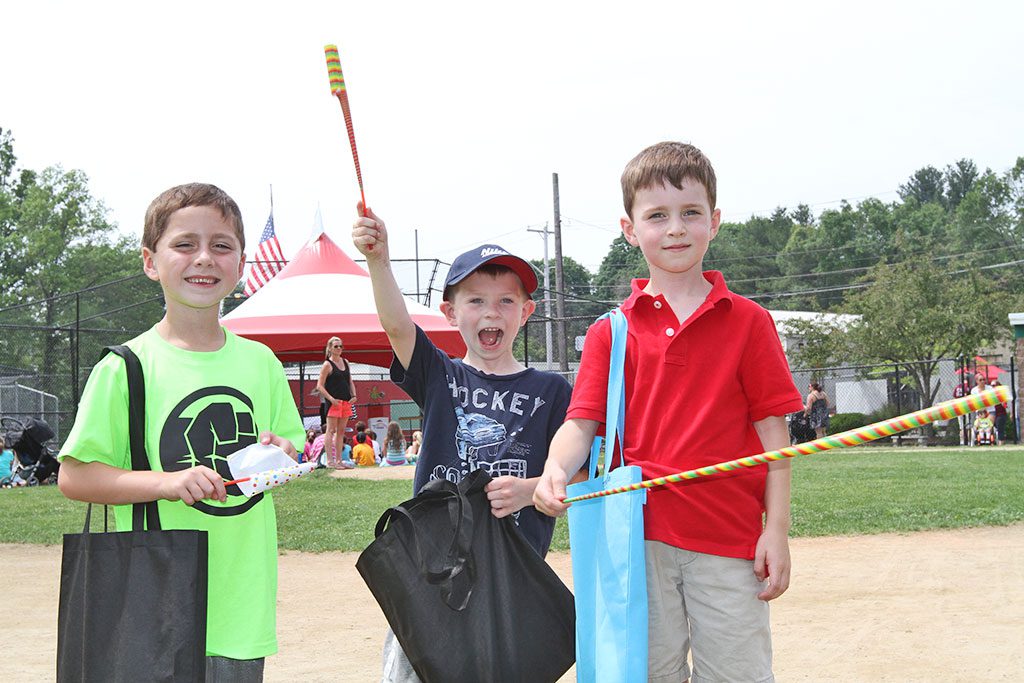 WINTHROP SCHOOL STUDENTS Jay Dennison, Nolan Clark, and Brendan Kilpatrick had a great time at the 2015 DPW Day held on Tremont Street Thursday, June 11. (Donna Larsson Photo)
