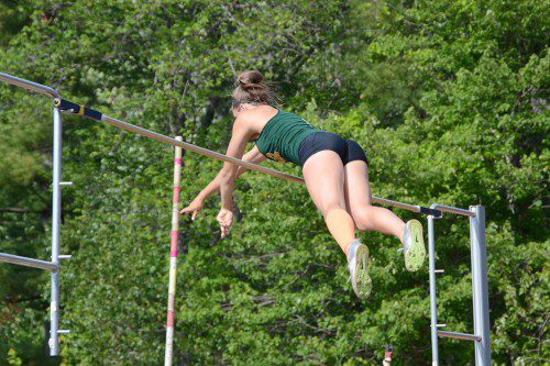 SOARING HORNET. Junior Julia Valenti clears the bar at 11 ft. 9 inches to win the state championship in the pole vault. (John Friberg Photo)